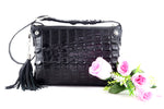 Rosie tote bag in black crocodile backstrap belly cut showing a front view 1 with flowers