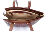 Tan crocodile backstrap belly cut showing view from the top into the bag. Crean lining showing the zip pocket