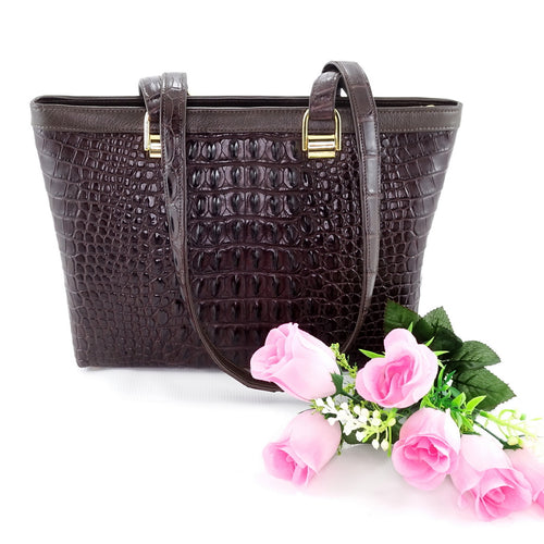 Emily tote bag in chocolate brown crocodile backstrap belly cut showing front view 1 with flowers