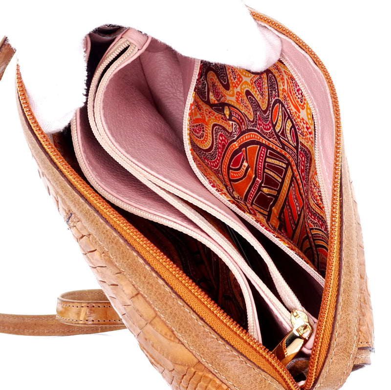 Handbag (Riley) Cross body bag saddle tan crocodile & leather top view showing the aborininal printed fabric used in the lining pockets