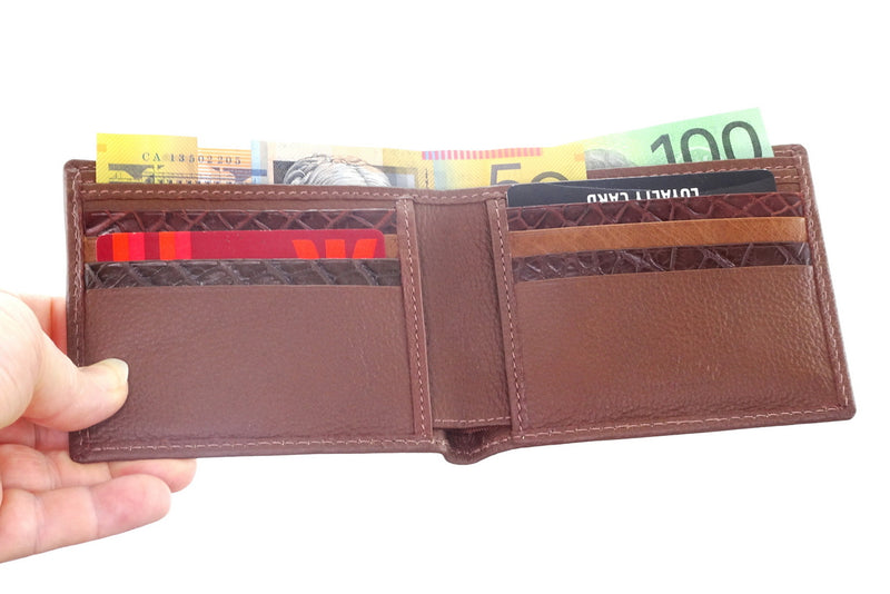 Brown leather Large bi fold martin wallet showing the inside pockets with cards & notes in place  held by the corner