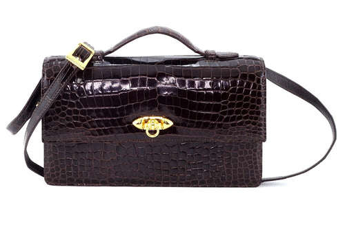 Handbag - cross body - (Tanya) Dark brown crocodile with handle. Front view with shoulder strap attached and lid handle raised.