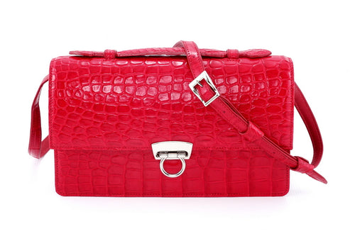 Handbag - cross body - (Tanya)  Red matt crocodile with Handle. This view is of the front with the shoulder strap attached and the lid handle sitting flat.