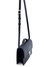 Handbag - cross body - (Tanya) black ostrich leather with handle. A side view with lid handle raised and shoulder straps fully extended