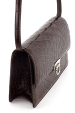 Handbag - cross body - (Tanya)  Chocolate matte crocodile. A view of the handbag from the side with the shoulder straps attached.