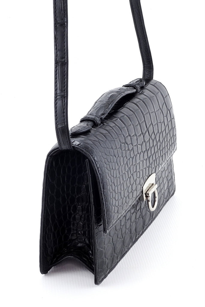 Handbag - cross body - (Tanya)  Black matt crocodile with Handle. A side view showing the gusset, lid handle and shoulder straps in the raised position.