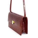 Handbag - cross body - (Tanya)  Cognac Tan glaze finish crocodile showing the handbag from the side showing the gussets. This photo shows the scale and colour of the crocodile skin.