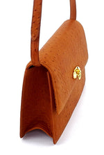 Handbag - cross body - (Tanya) Tan ostrich leather with handle. A side view showing the gusset configuration.