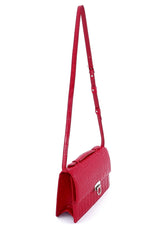 Handbag - cross body - (Tanya)  Red matt crocodile with Handle. A view of the side showing gusset, shoulder strap fully extened and lid handle sitting flat.