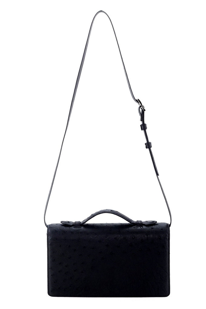 Handbag - cross body - (Tanya) black ostrich leather with handle. A back view with the shoulder straps fully extended and lid handle raised.