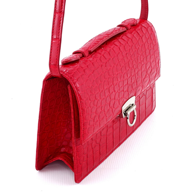 Handbag - cross body - (Tanya)  Red matt crocodile with Handle. A side gusset view showing the texture and pattern of the crocodile skin leather.