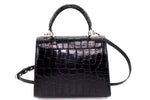 Handbag -traditional - (Beverly) - Black matt crocodile. This view is of the bag from the back with the shoulder strap still attached.