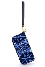 Purse - zip around - (Michaela) - Denim fabric with swirl pattern showing purse suspended by wrist strap