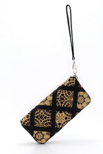 Purse - zip around - (Michaela) Hessian fabric - black & straw colours showing purse suspended by wrist strap