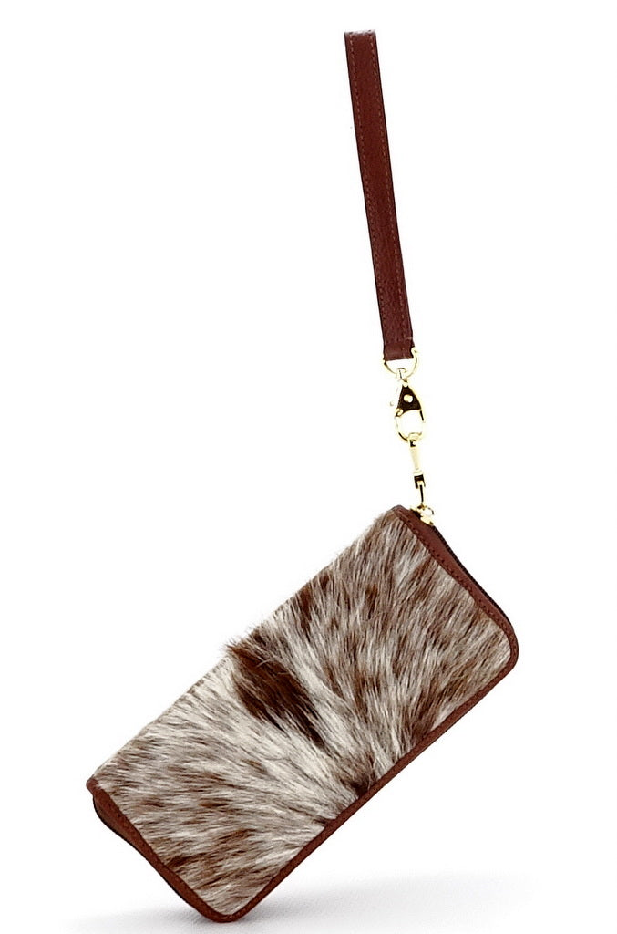 Purse - zip around - (Michaela) Tan hair on cow hide showing purse suspended by wrist strap