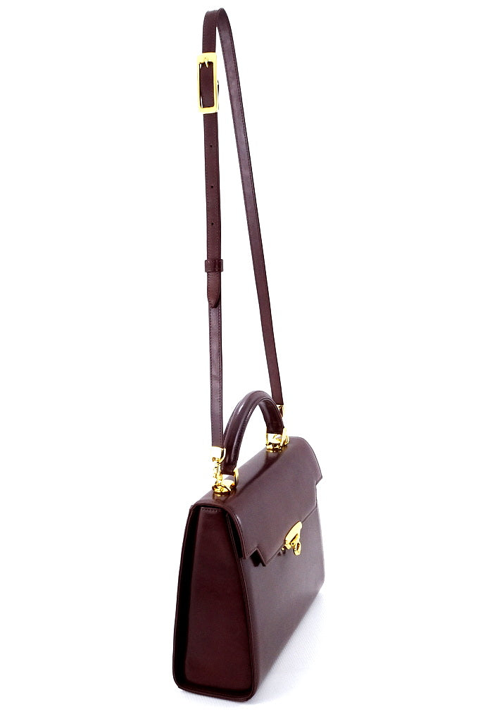 Handbag -traditional - (Joan) Brown gloss leather with gold fittings showing side view of bag with shoulder straps extended