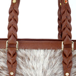 Tan Hair on hide with tripple blood knott strap leather tote bag showing blood knot and fittings
