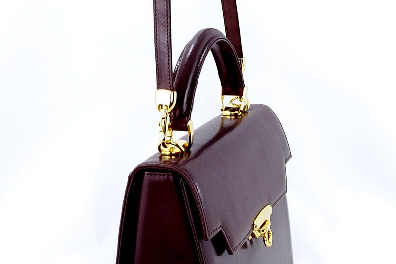 Handbag -traditional - (Joan) Brown gloss leather with gold fittings showing shoulder strap and handel attachment