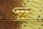 Handbag - cross body - (Tanya)  Leather print in yellow & brown. A close up of the gold plated front fitting.