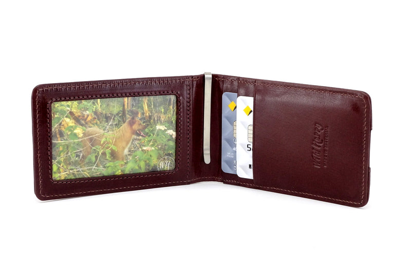 Tan leather bill fold wallet inside pockets in use