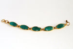 Gold plated bracelet in jade green sea snake skin