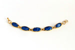 Gold plated bracelet in foil blue leather