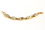 Gold plated bracelet in brown and white sea snake