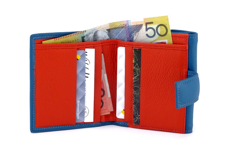 Ladies leather purse azure blue inside view orange leather showing credit cards and money