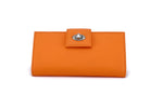 Molly  Pale Orange textured leather ladies clutch purse front nickel fitting