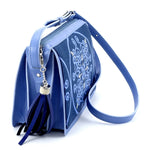 Riley Cross body bag denim fabric & astral blue leather tassel end view