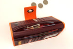 Molly  Pale Orange textured leather ladies clutch purse showing coin section in use