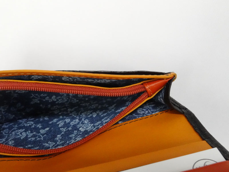 Caitlin  Black ostrich mango & orange detail ladies purse showing coin zip section