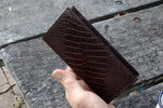 Sam  Cowboy men's wallet Burgundy printed leather held in hand