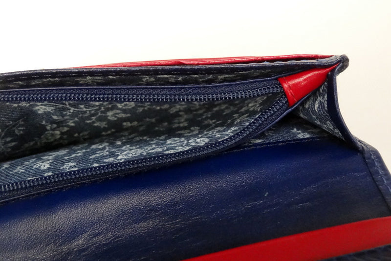 Caitlin  Royal blue leather with rojo ostrich leg detail ladies purse showing coin zip section