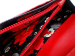 Caitlin  Black leather with red accents ladies purse showing coin zip section