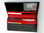 Caitlin  Black leather with red accents ladies purse inside view showing in use