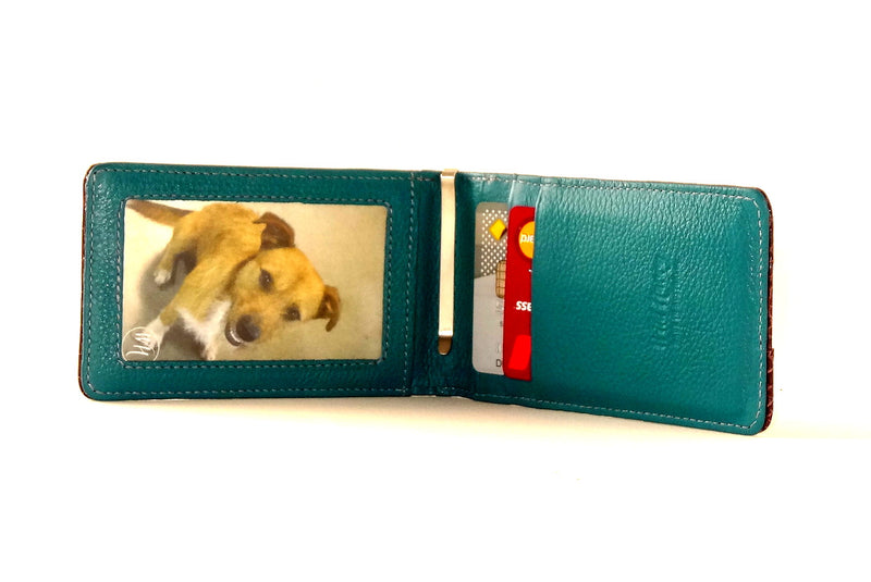 Billfold teal leather showing inside view picture window and credit pockets in use