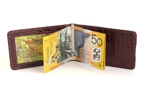 Bill fold wallet inside view showing money clip in use