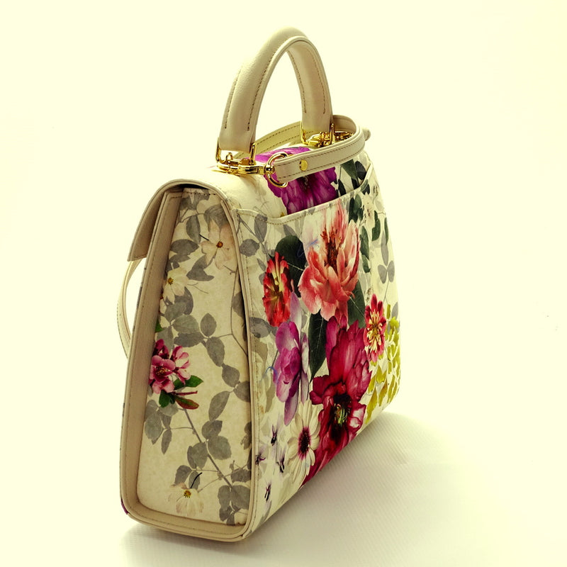 Handbag -traditional - (Joan) - Bright floral canvas & cream leather showing the side view of gusset & back with shoulder strap attached.