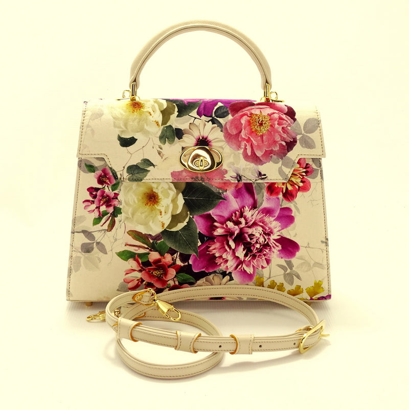Handbag -traditional - (Joan) - Bright floral canvas & cream leather showing the front view with shoulder strap no attached coiled up 