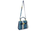 Handbag - traditional - (Beverly) Blue & white printed leather showing angled front view with shoulder strap extended and also showing the feature skin